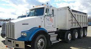 image of white and blue cds dump truck