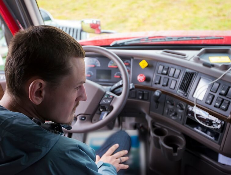 image of student sitting in truck cab looking at dials