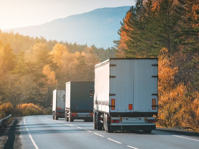 image of trucks driving down a road